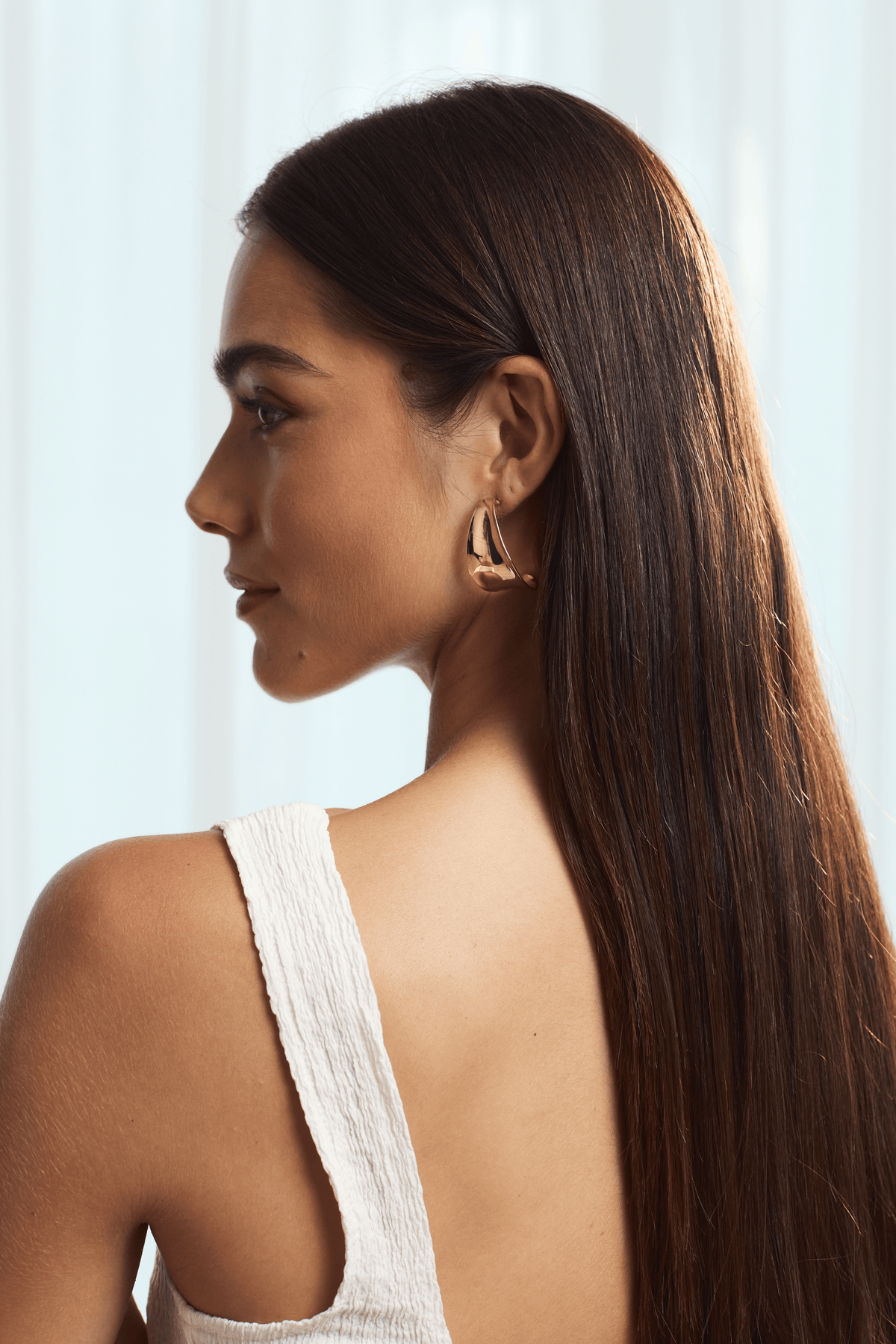 Gold Curve Twisted Hoop